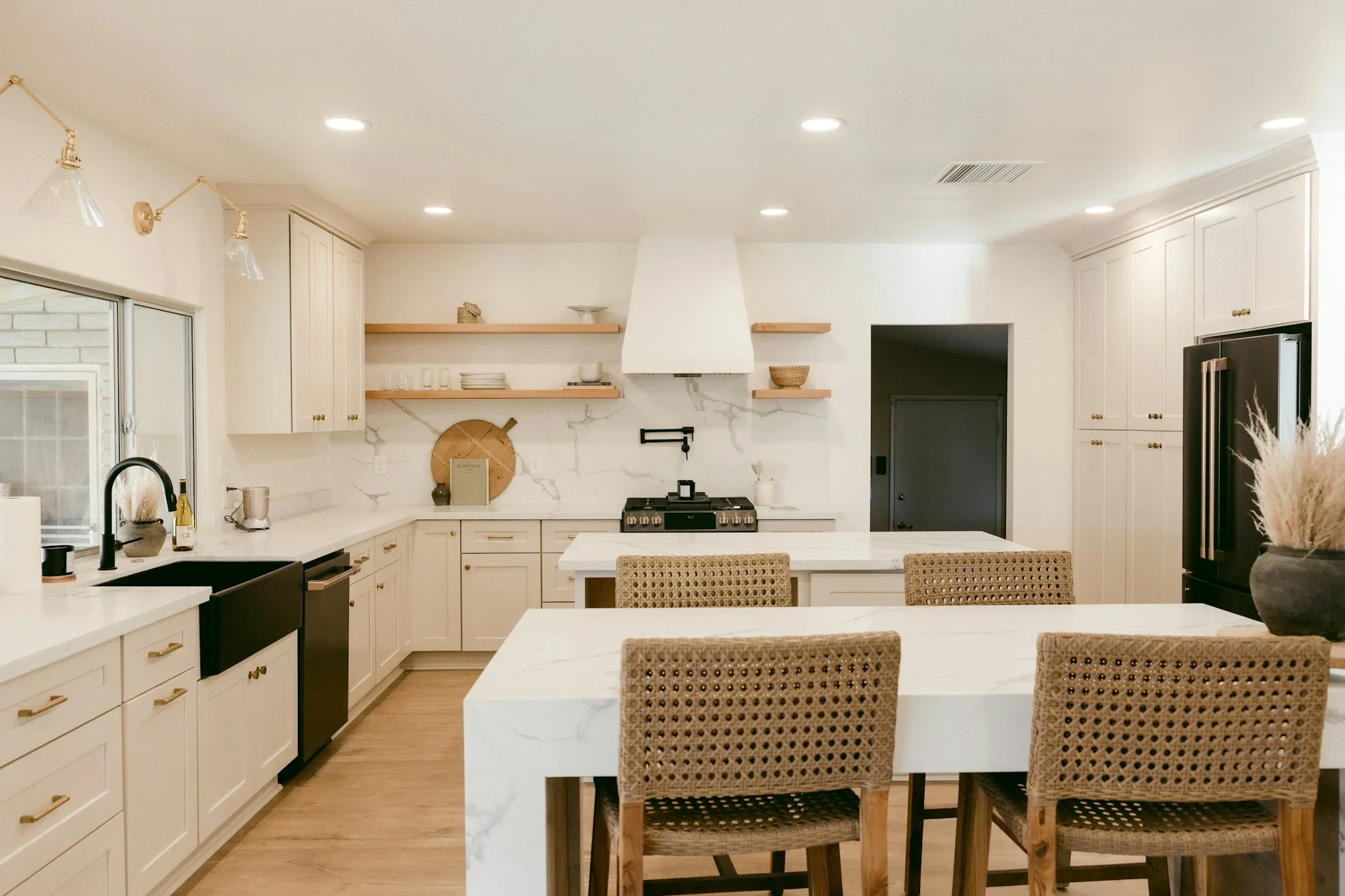 A kitchen with recessed lighting and a central island